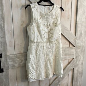 White flowy mini dress with pretty detailing